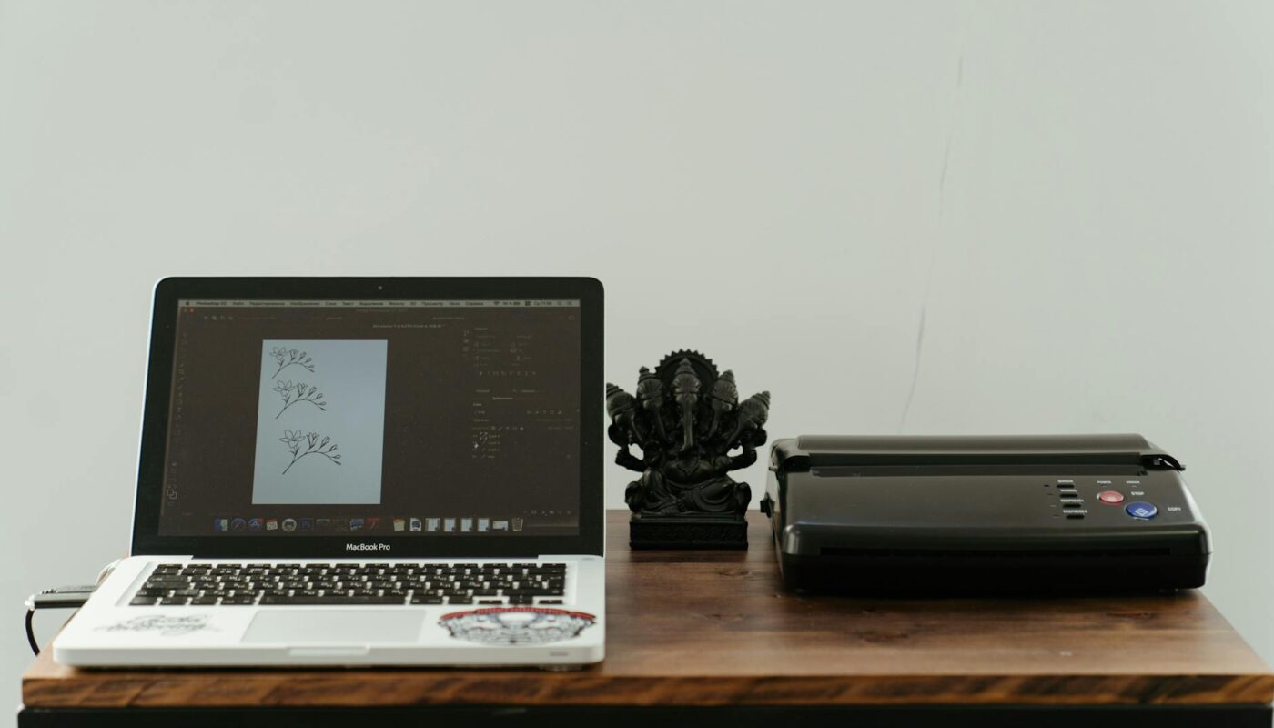 macbook pro on brown wooden table